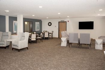 Recently updated community room  with tv, seating for games and puzzles